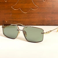 gold-w-green-lens